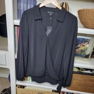 NWT wrap front blouse with shirtail hem in back.